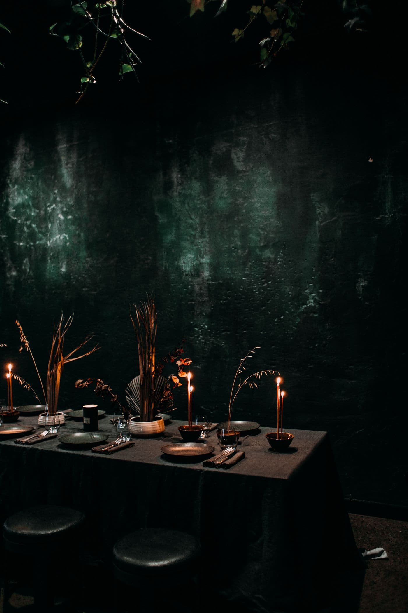 Candlelit banquet table with white calla lilies and warm golden light